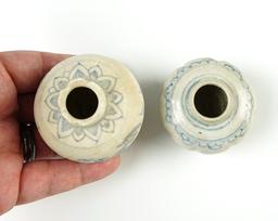 Pair of pottery vessels from the Hoi An Hoard with original catalog number stickers on bottom.