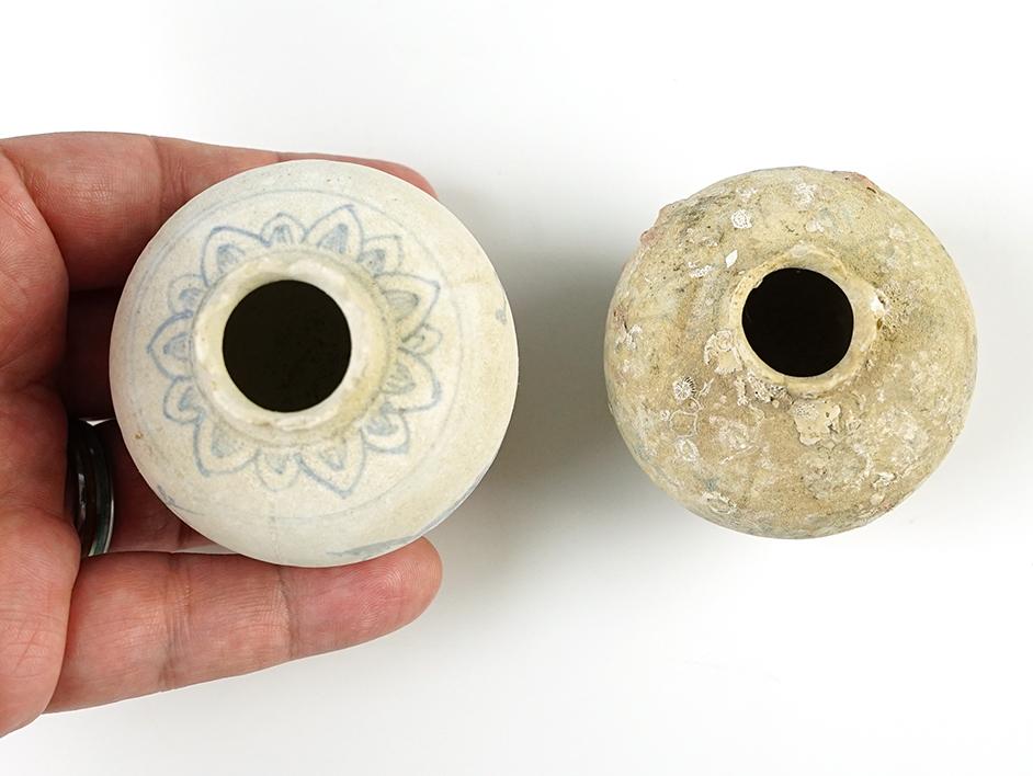 Pair of pottery vessels from the Hoi An Hoard with original catalog number stickers on bottom.