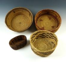 Set of 4 assorted woven baskets. Largest is 8 1/4" diameter.