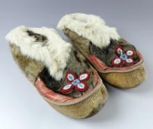 Well crafted pair of vintage moccasins that measure 9".