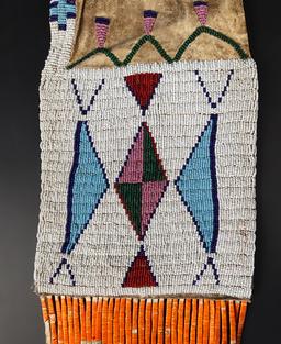 Circa 1880's Sioux or Cheyenne Pipe Bag that is 25" long. No bead loss. Very collectible!