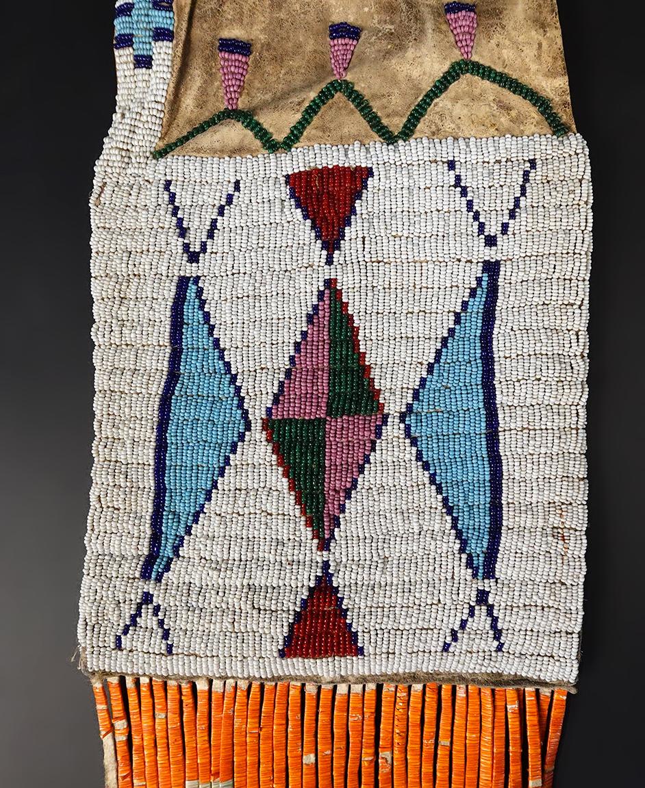 Circa 1880's Sioux or Cheyenne Pipe Bag that is 25" long. No bead loss. Very collectible!