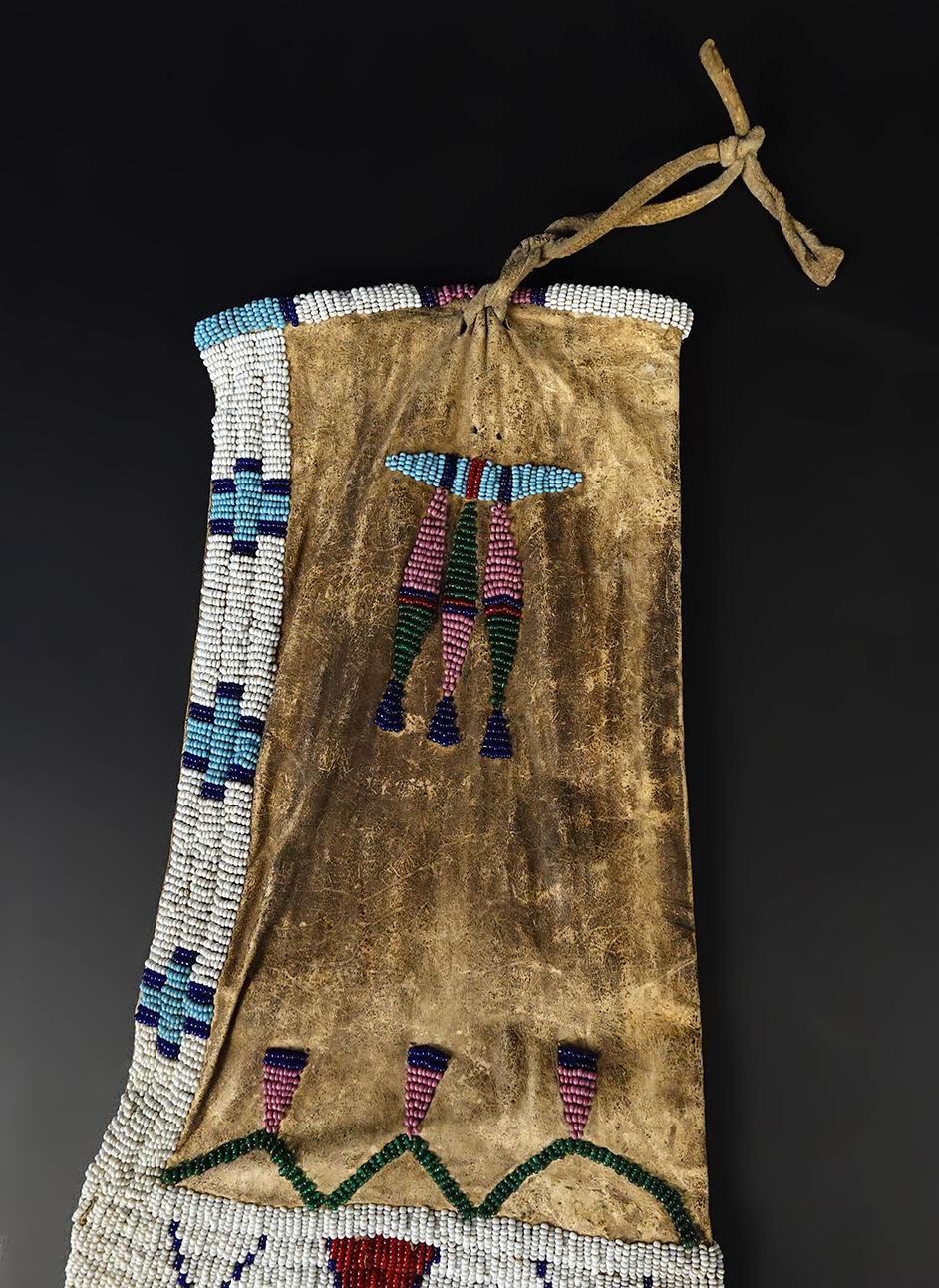 Circa 1880's Sioux or Cheyenne Pipe Bag that is 25" long. No bead loss. Very collectible!