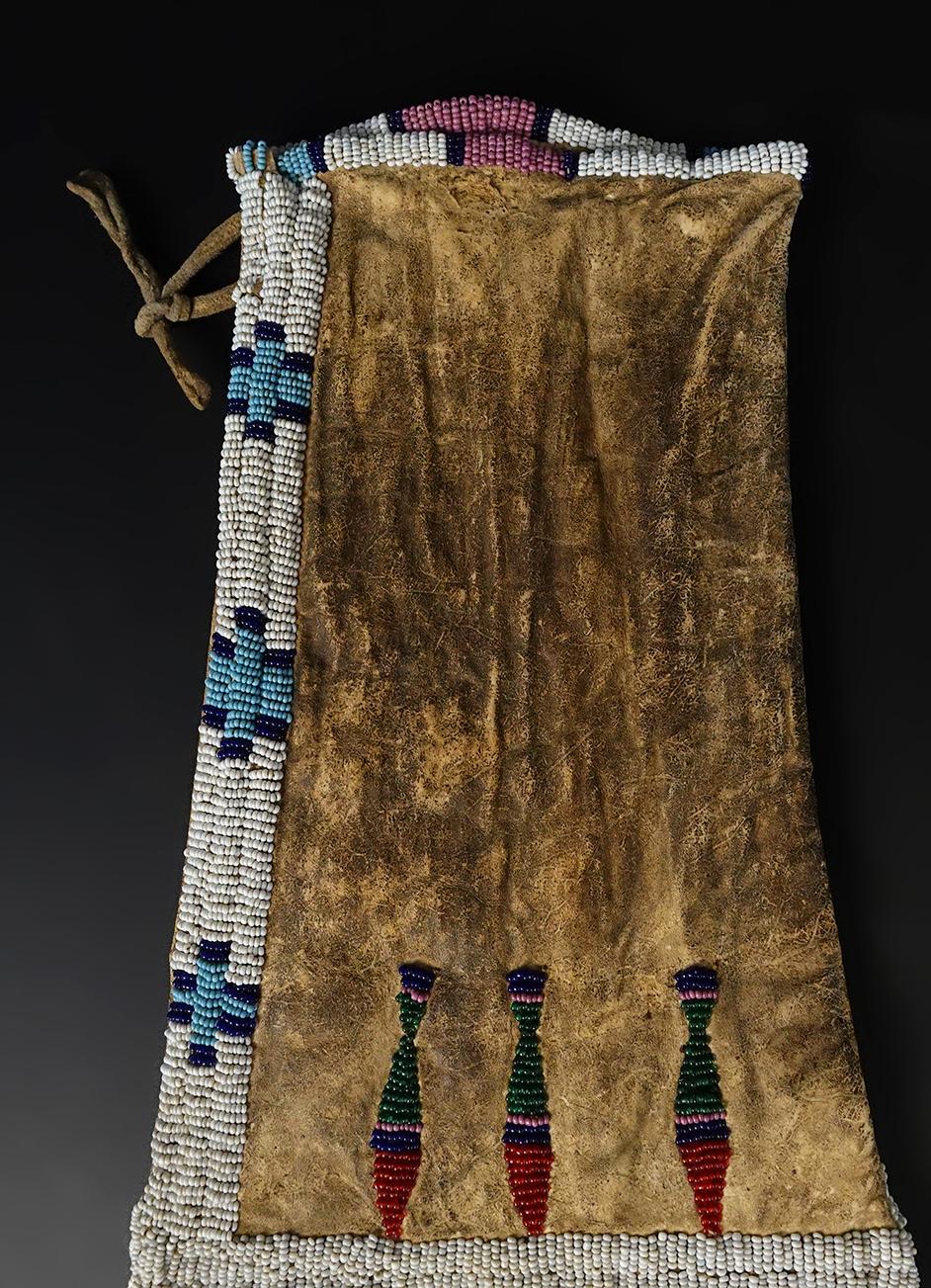 Circa 1880's Sioux or Cheyenne Pipe Bag that is 25" long. No bead loss. Very collectible!