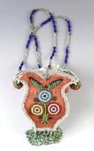 7" tall by 4 1/2" wide Iroquois Hanging Open Top Purse. Design includes birds and floral motif.