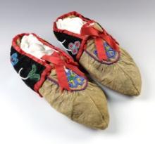 Pair of 10" Floral Pattern Moccasins in overall good condition for age. A couple spots of repair.