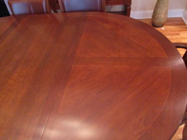 Stanley Furniture Dining Table with Six Cane/Leather Back Chairs, and Table Protectors
