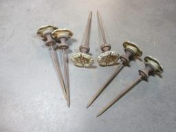 Six Metal Flower Spike Hose Guides in Bucket