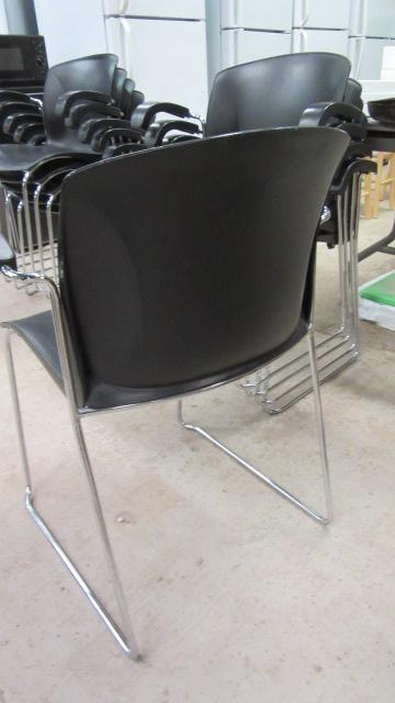 Five Harter a Jami Co. Black and Chrome Stacking Armchairs