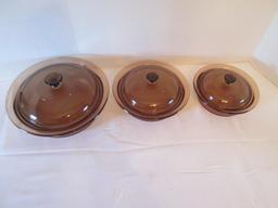 Three Round Amber Brown Vision Ware Lidded Casserole Dishes