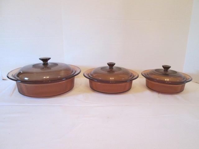 Three Round Amber Brown Vision Ware Lidded Casserole Dishes