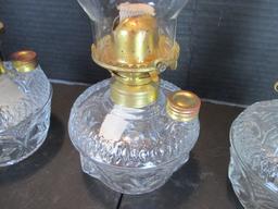 Three Clear Glass Star Design Oil Lamps