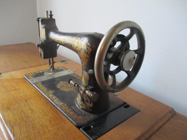 Antique Singer Treadle Sewing Machine in Tiger Oak Cabinet