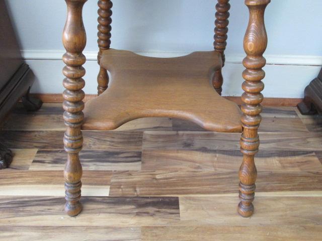 Antique Tiger Oak Clover Leaf Table with Undershelf and Turned Spindle Legs