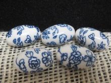 Four Egg Shaped Porcelain Beads