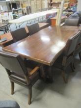 Live Edge Heavy Wood Table with Two Arm Chairs and Four Side Chairs.