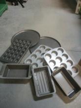 Box of Baking Pans, Bread Pans, Pizza Trays, Muffin Tins.
