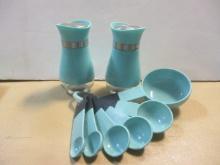 Teal Salt/Pepper Shakers and Six Plastic Measuring Spoons.