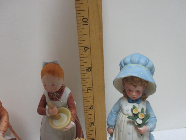 Four Holly Hobby Figurines and Old Man and Woman Figurine.