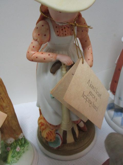 Four Holly Hobby Figurines and Old Man and Woman Figurine.