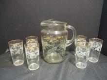 Mid Century Glass Pitcher with Six Matching Tumblers with Gold Rim and Etched Grape Design.