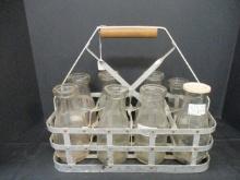 Eight Vintage Milk Bottles with Metal Milk Crate.