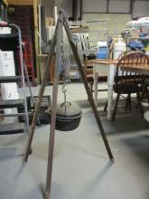 Cast Iron Pot with Lid on Tripod for Cooking.