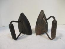 Two Cast Iron Sad Irons with Handles. On Top Number 6 and 6 with Star.