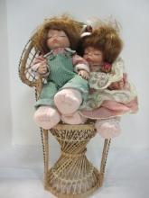 Boy and Girl  "Sleeping" Porcelain Dolls Sitting on Rattan Chair