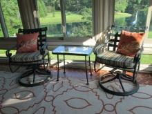 Pair of Painted Green Metal Swiveling Rocking Patio Chairs and Woodard Glass Top Side Table