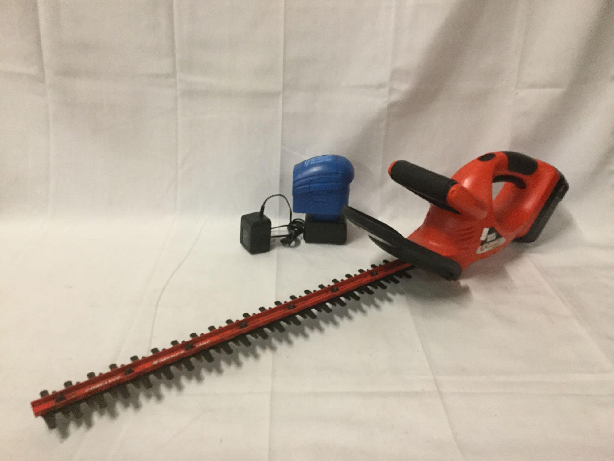 Black and Decker Hedgehog cordless 558mm hedge trimmer with Power Glide battery and charger