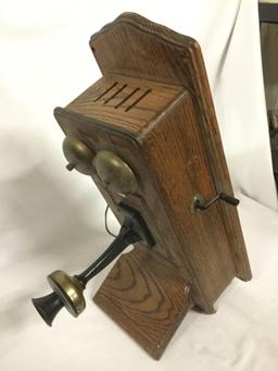 Vintage T.D.Y. Telephone Company hand crank type wood wall phone with dial, phone line, and extra