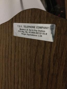 Vintage T.D.Y. Telephone Company hand crank type wood wall phone with dial, phone line, and extra