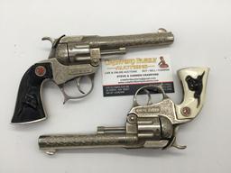Pair of vintage Hubley Tex model revolver cap gun pistol w/ ornate designs and steer head handles
