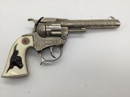 Pair of vintage Hubley Tex model revolver cap gun pistol w/ ornate designs and steer head handles