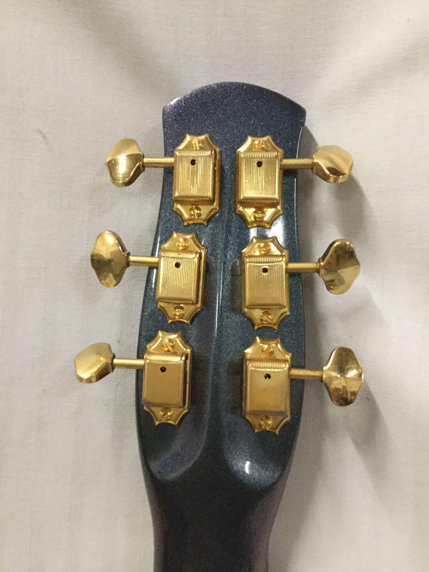 Custom modified Danelectro Longhorn electric guitar w/ burled maple top and custom fitted hard case.