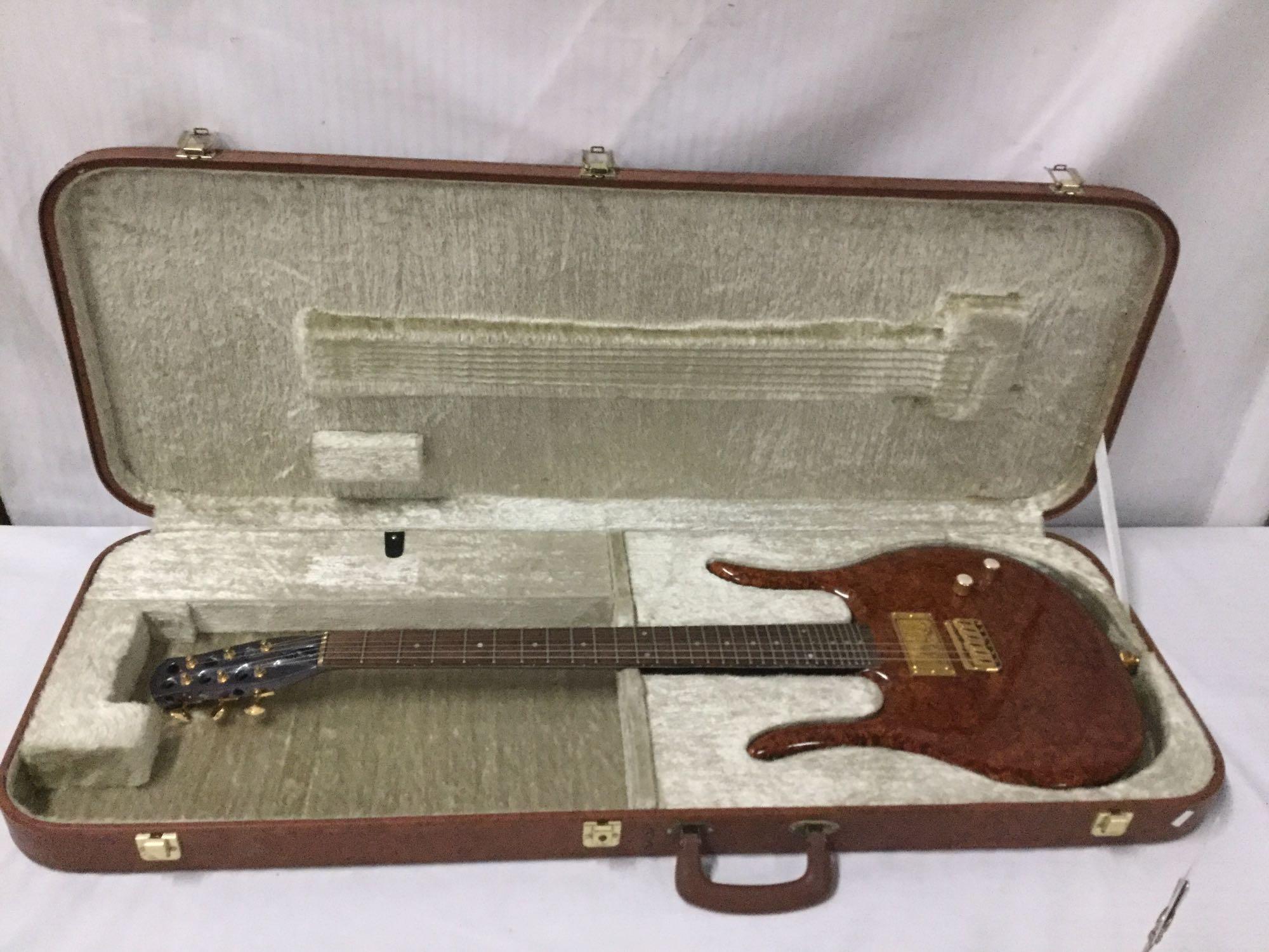 Custom modified Danelectro Longhorn electric guitar w/ burled maple top and custom fitted hard case.