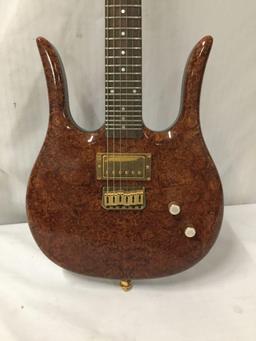 Custom modified Danelectro Longhorn electric guitar w/ burled maple top and custom fitted hard case.