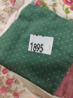 Large vintage hand made quilt feat. an overlapped circular pattern with some light wear