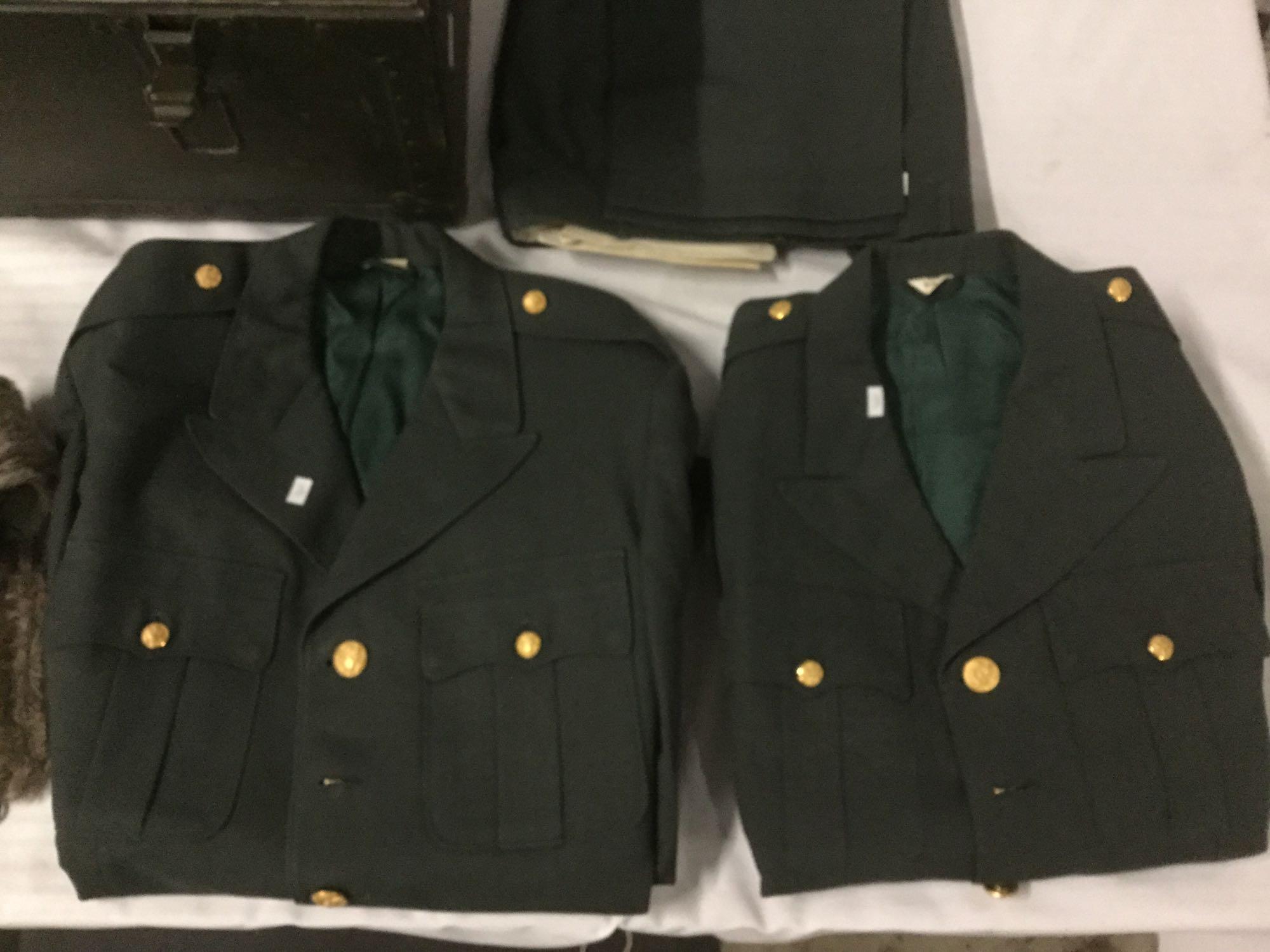 Vintage trunk full of small sized military clothing incl. 3 hates, 2 full uniforms, 2 sacks and