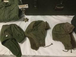 Vintage trunk full of small sized military clothing incl. 3 hates, 2 full uniforms, 2 sacks and