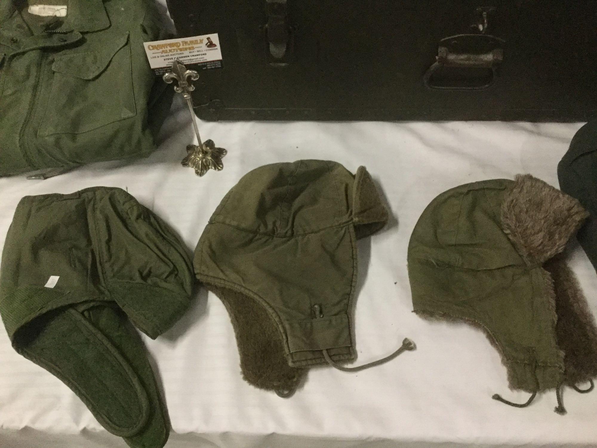 Vintage trunk full of small sized military clothing incl. 3 hates, 2 full uniforms, 2 sacks and