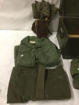 Vintage trunk full of small sized military clothing incl. 3 hates, 2 full uniforms, 2 sacks and