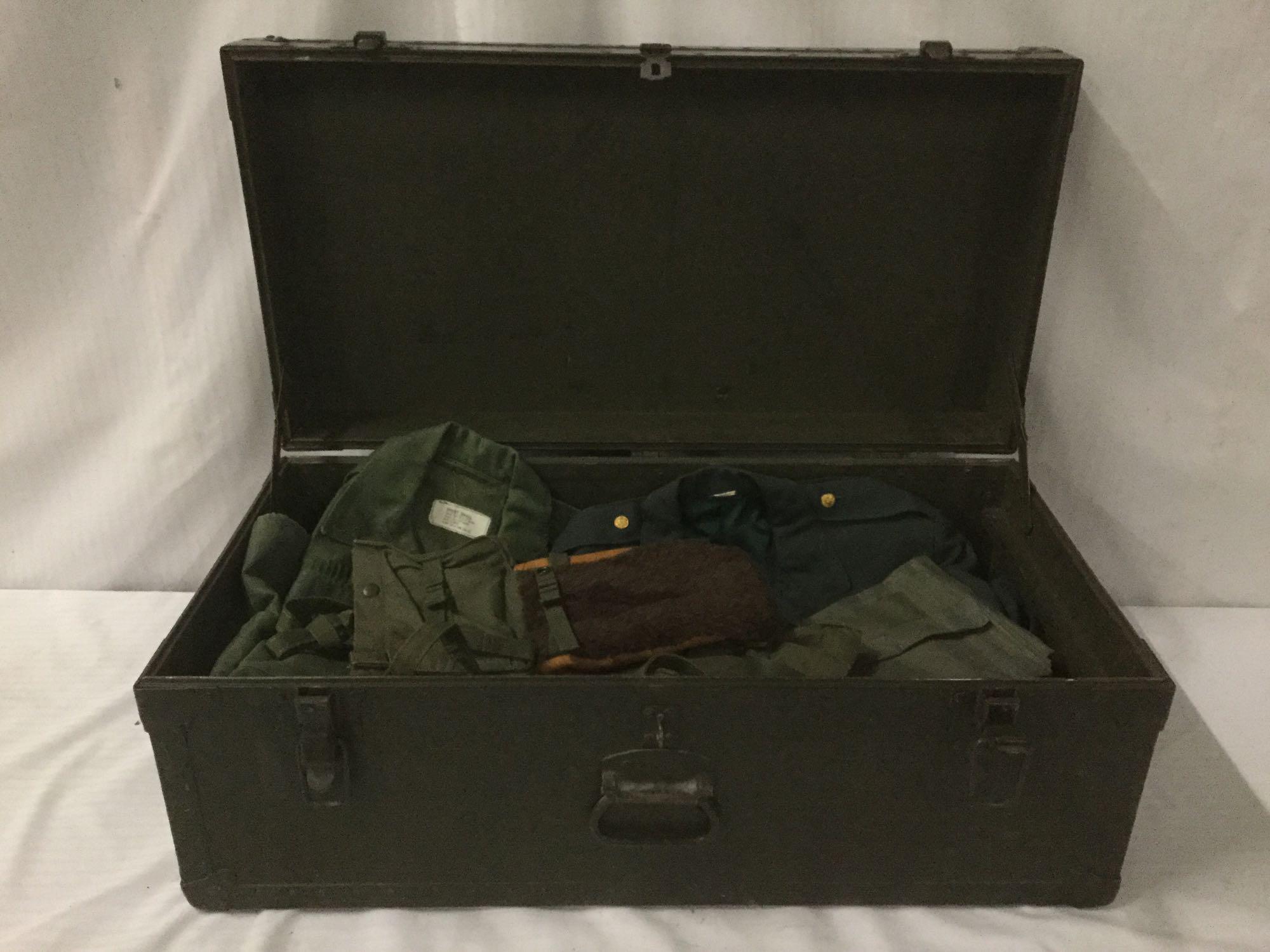 Vintage trunk full of small sized military clothing incl. 3 hates, 2 full uniforms, 2 sacks and
