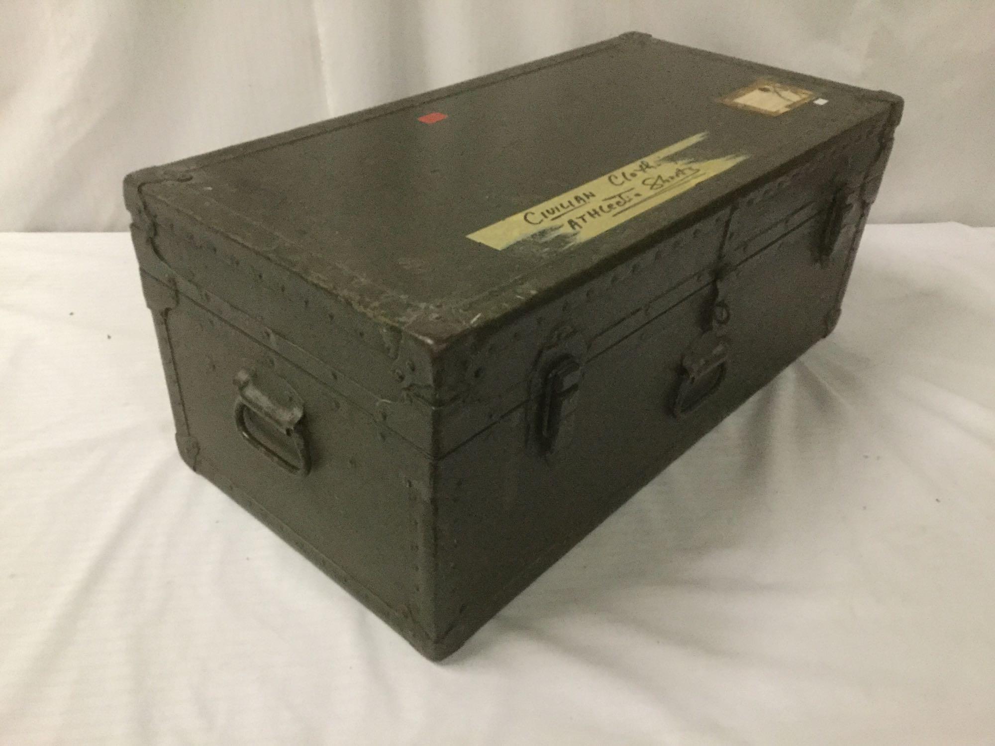 Vintage trunk full of small sized military clothing incl. 3 hates, 2 full uniforms, 2 sacks and