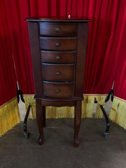 Brown stained wood jewelry box with five drawers and top.
