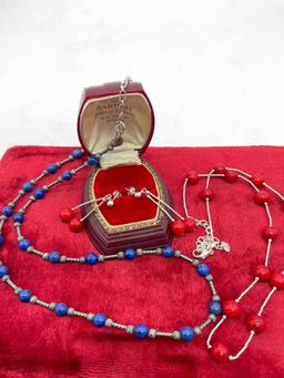 Pair of sterling silver red and blue stone bead necklaces, one with matching earring pair