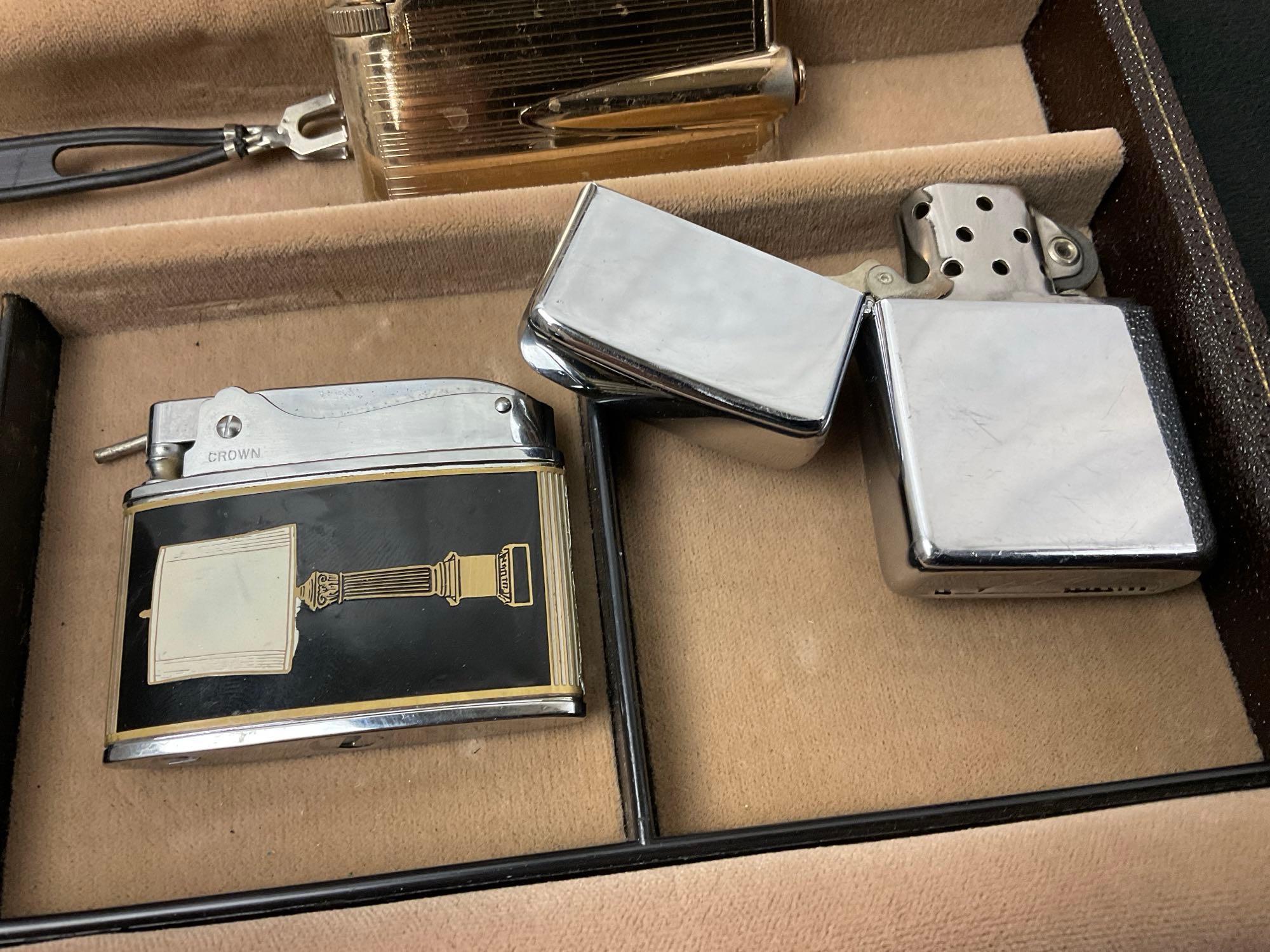 4 Vintage Lighters in Leather Case, Engraved Vietnam Zippo, a similarly aged Zippo, Ronson & Crown