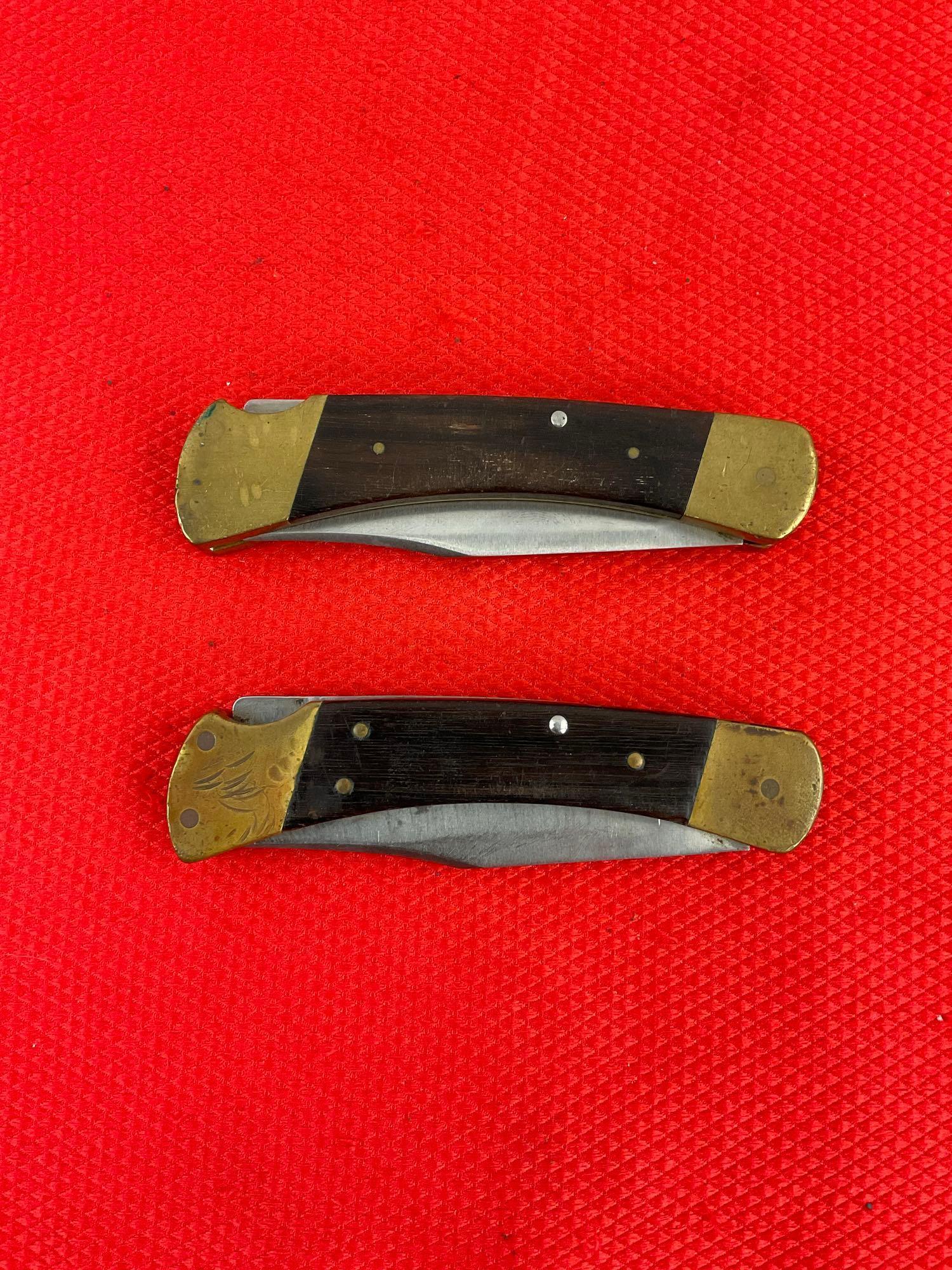 Pair of Vintage Buck 3.75" Steel Folding Blade Pocket Knives Model 110 w/ Ebony Handles. See pics.