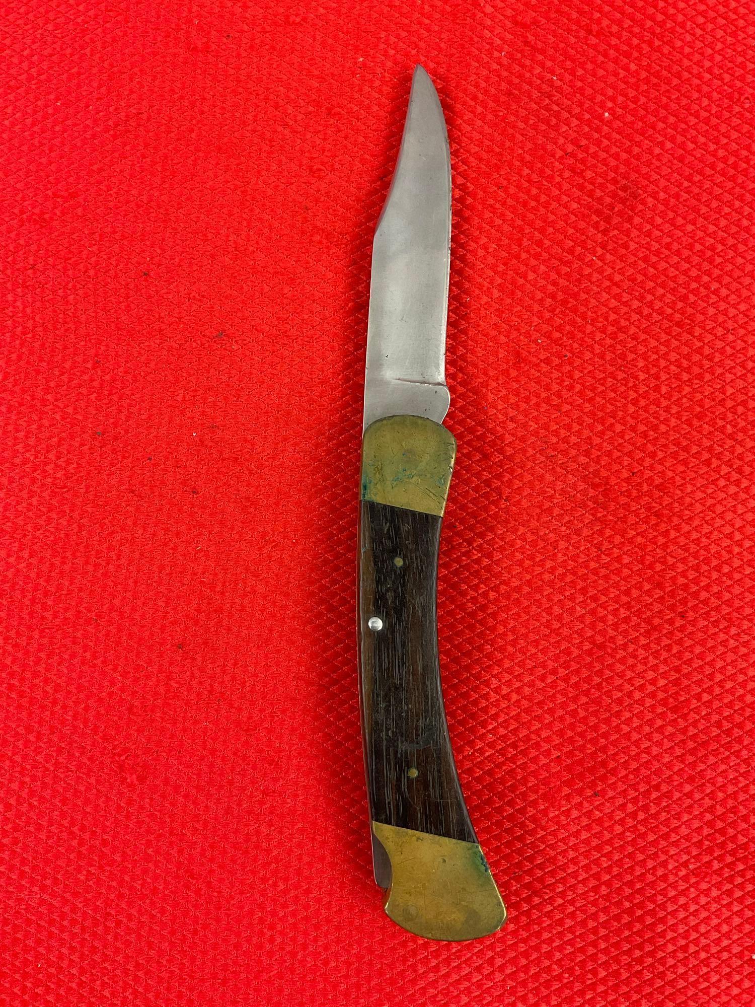 Vintage Buck 3.75" Steel Folding Blade Pocket Knife Model 110 w/ Ebony Handle & Original Sheath. ...